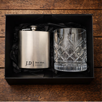 Personalised hip flask and glass set in a black box on a wooden surface