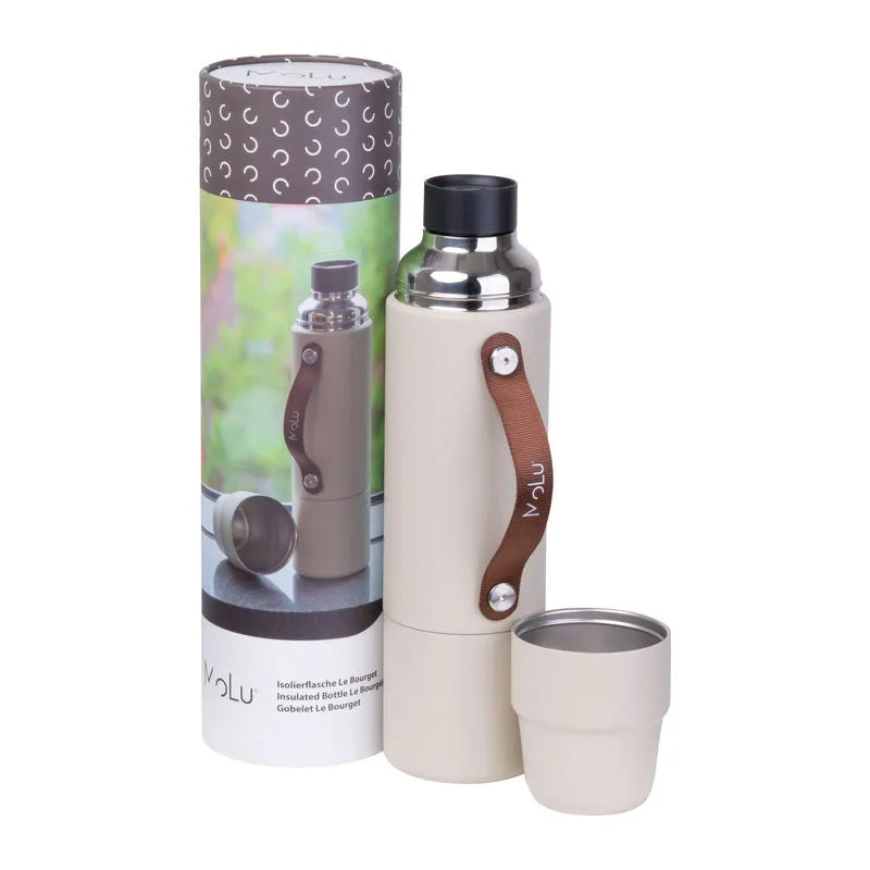 Beige insulated bottle with brown handle and matching cup, next to its packaging on a white background