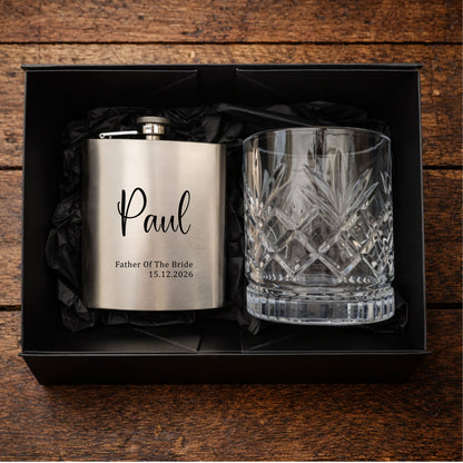 Personalised hip flask and glass set in a black box on a wooden surface