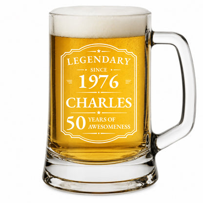 Glass mug with beer, engraved with 'Legendary since 1976 Charles 50 years of awesomeness'.