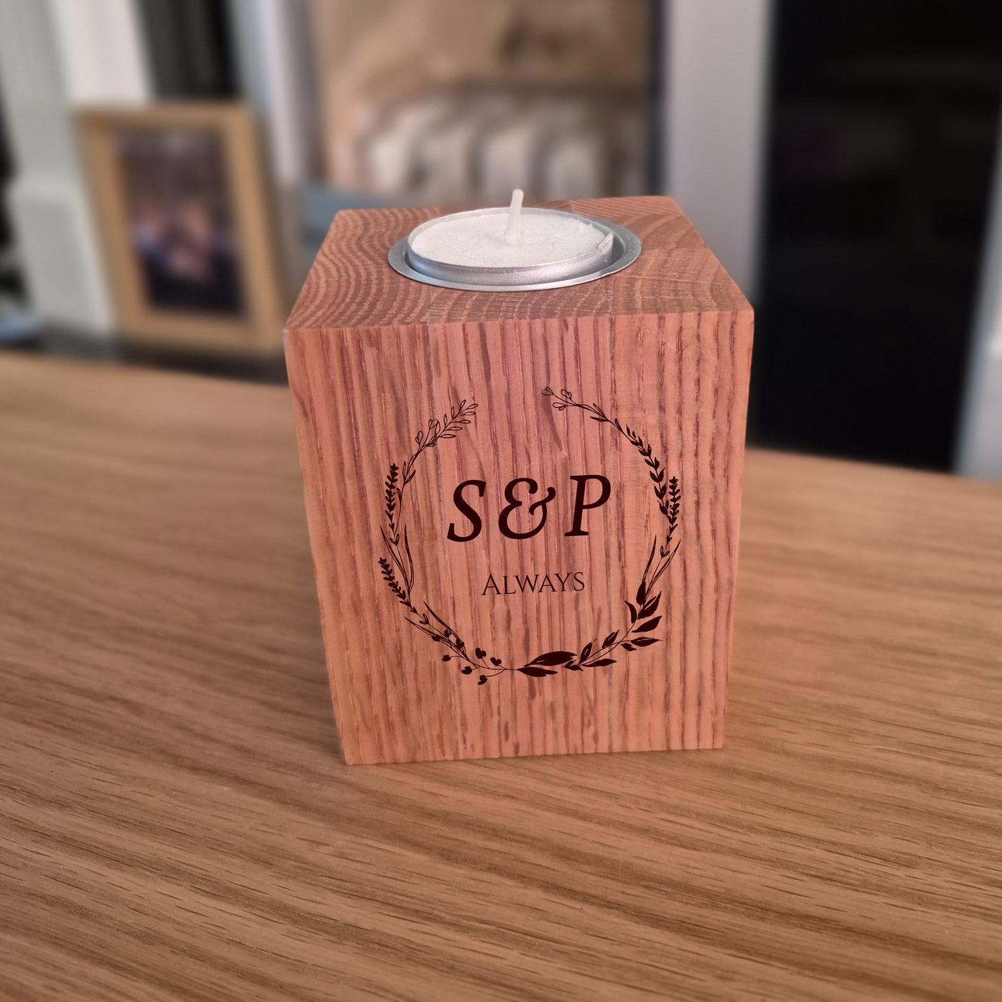 Oak tealight holder with initials 'S&P' and the word 'ALWAYS', engraved on a wooden surface.