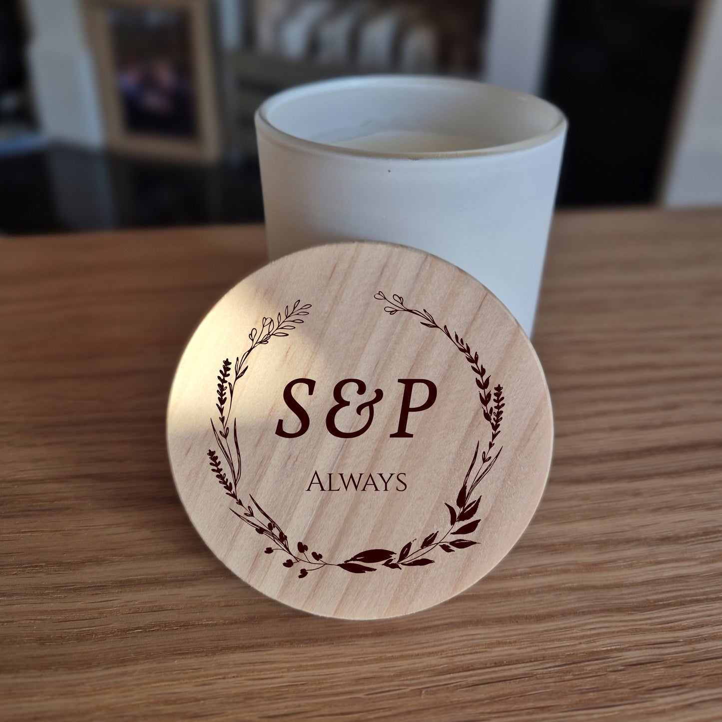 White jar candle with engraved wooden lid with 'S&P Always' design.