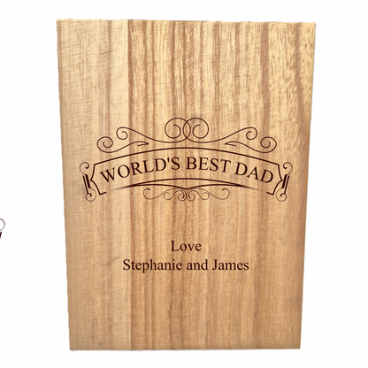 Wooden whisky set with 'World's Best Dad' engraving on a white background