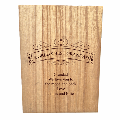 Wooden whisky set with engraved text 'World's Best Grandad' and personalized message.