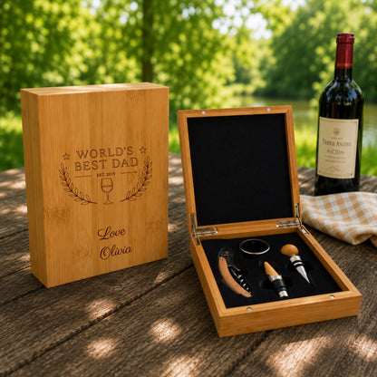 Wooden gift set with wine accessories and engraved message on a wooden table outdoors.