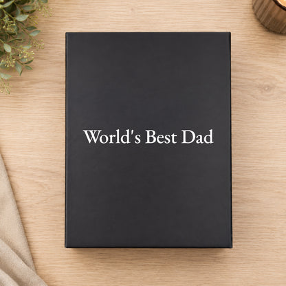 Black box with 'World's Best Dad' text on a wooden surface