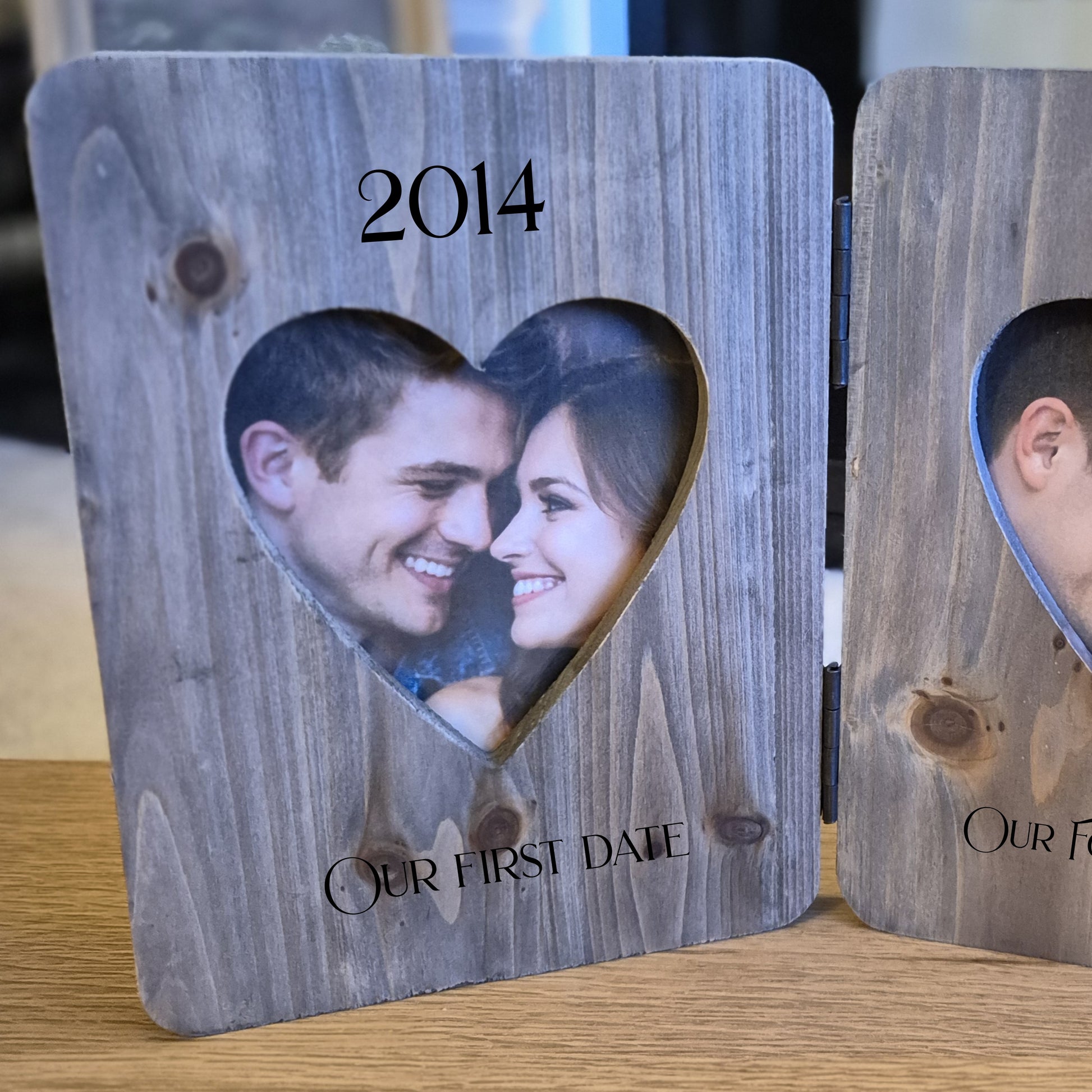 Double phot frame with heart cutouts showing a couple's photos from 2014 and 2025.