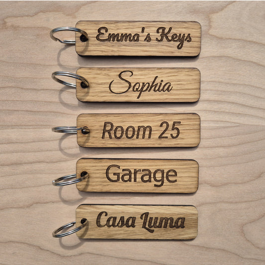 5 Oak keyrings measureing 90 x 25 x 4mm. Each keyring is engraved in a different font.