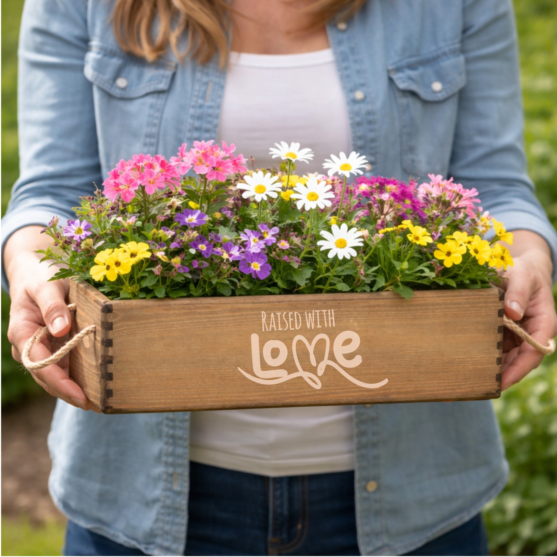 Brown mother's day planter with Raised With Love 
engraved to the front.