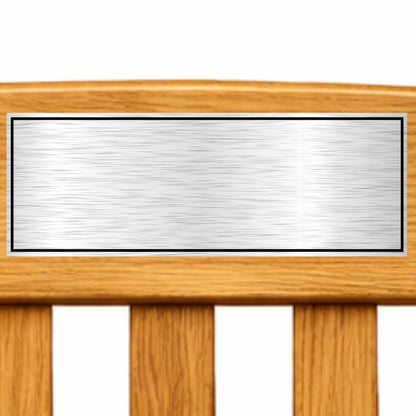 Wooden bench with a stainless steel plaque on a white background