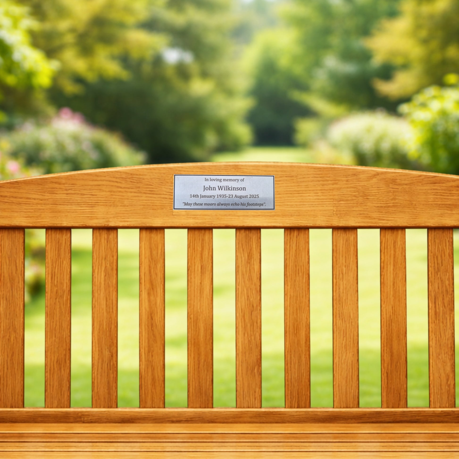 Wooden bench with a plaque in a garden setting