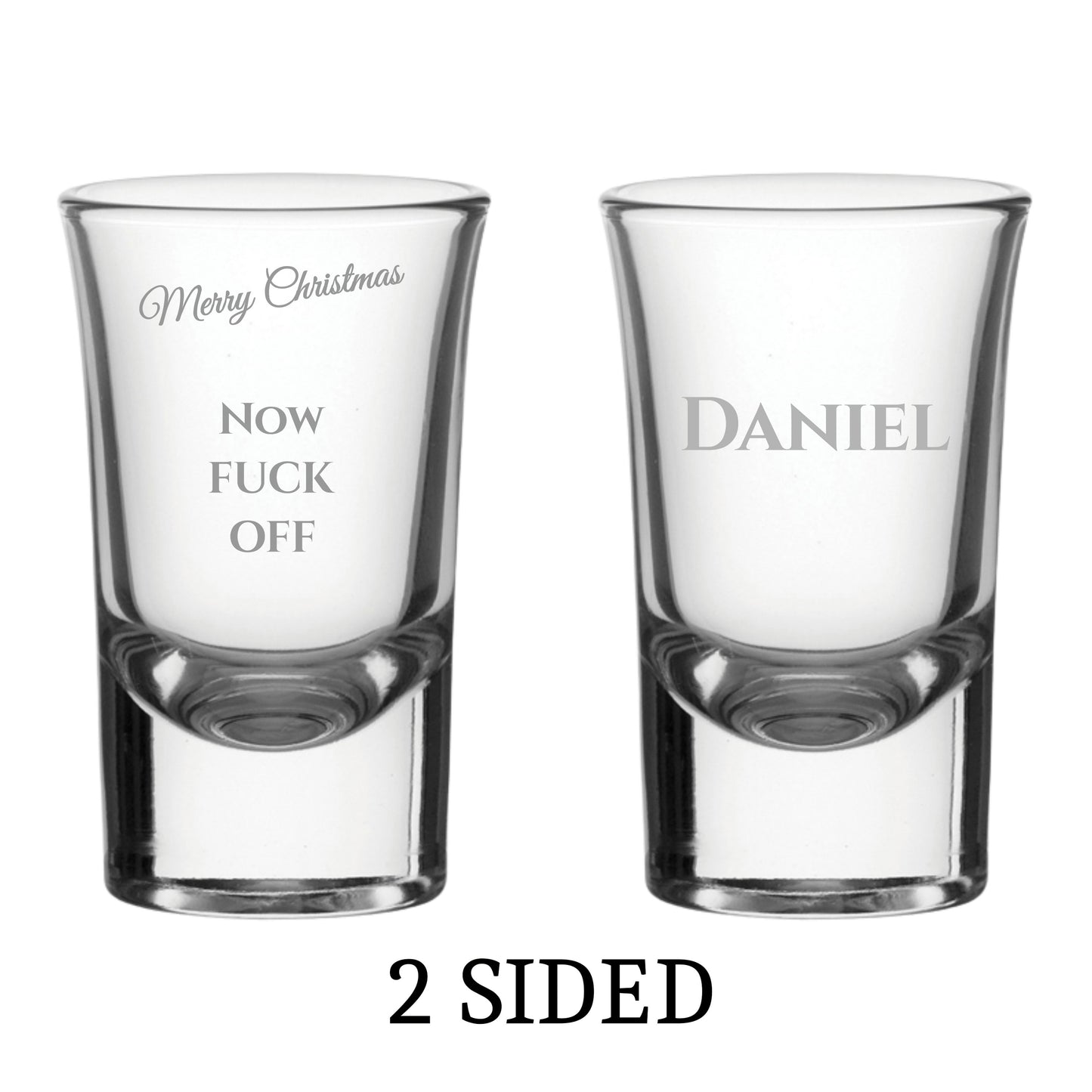 Two clear shot glasses with printed text on a white background