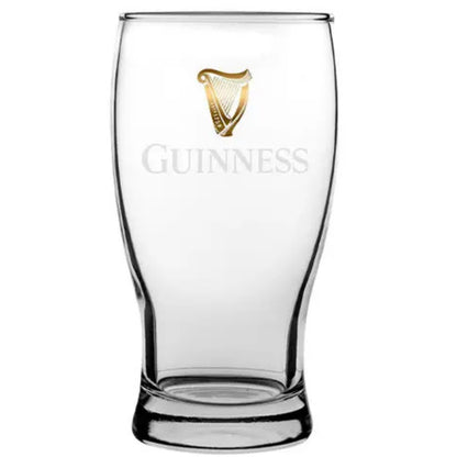 Clear Guinness glass with gold harp logo on a white background