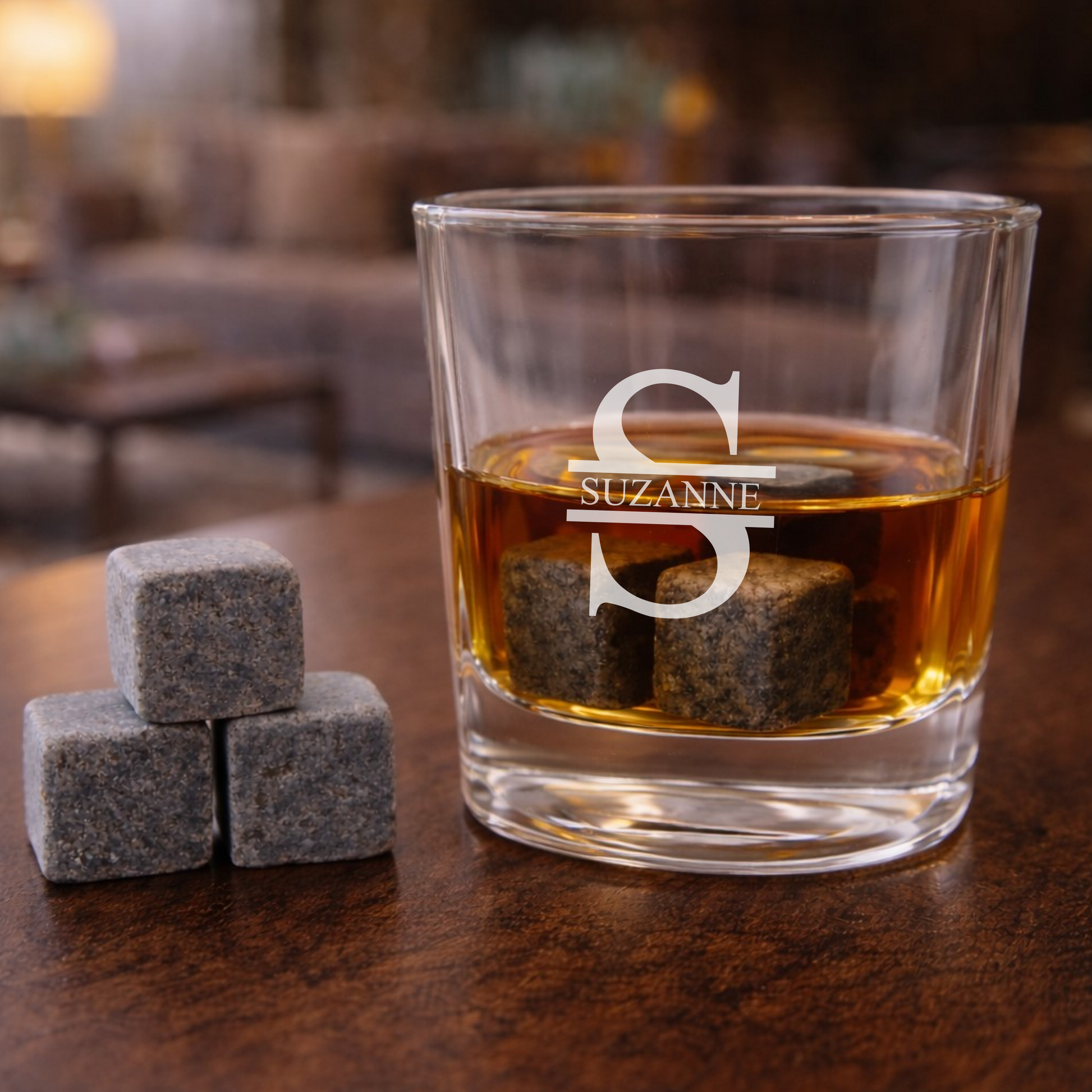 Engraved whisky glass with whisky stones.