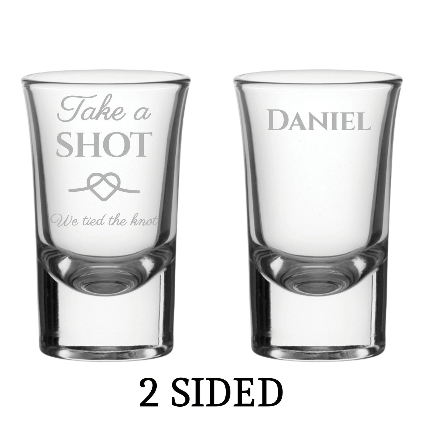 Two personalised shot glasses with engraved text on a white background