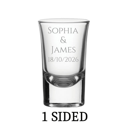 Clear personalised shot glass with engraved text on a white background