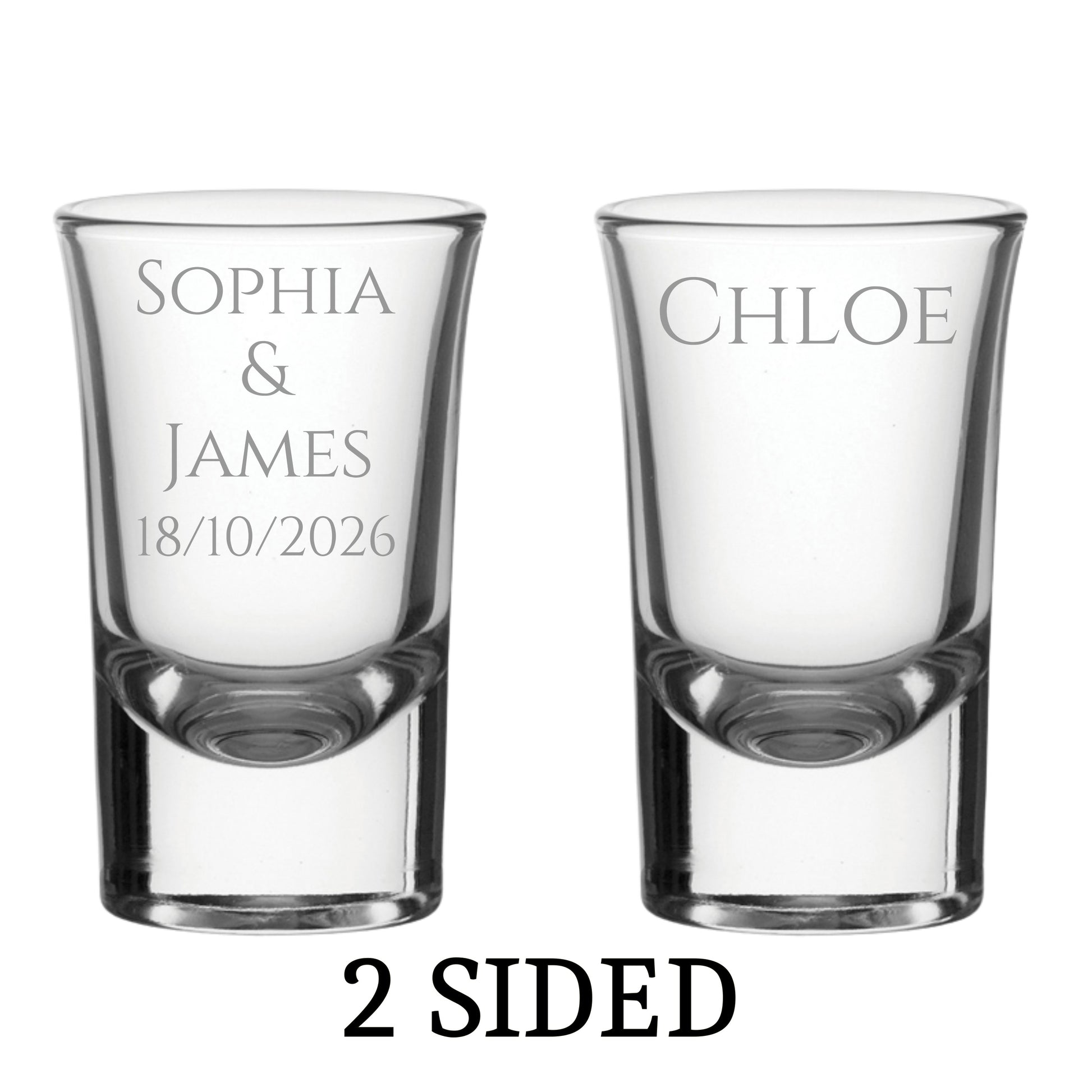 Two clear shot glasses with engraved names and date on a white background