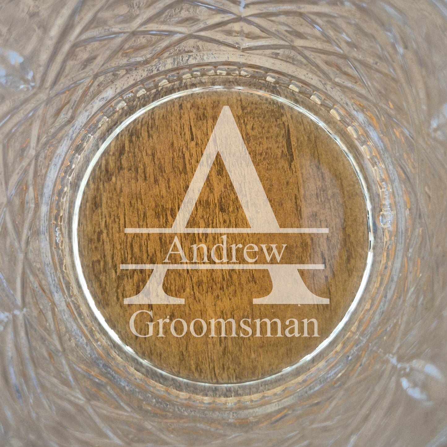 Image of Monogram A and groomsman engraved into cut glass.