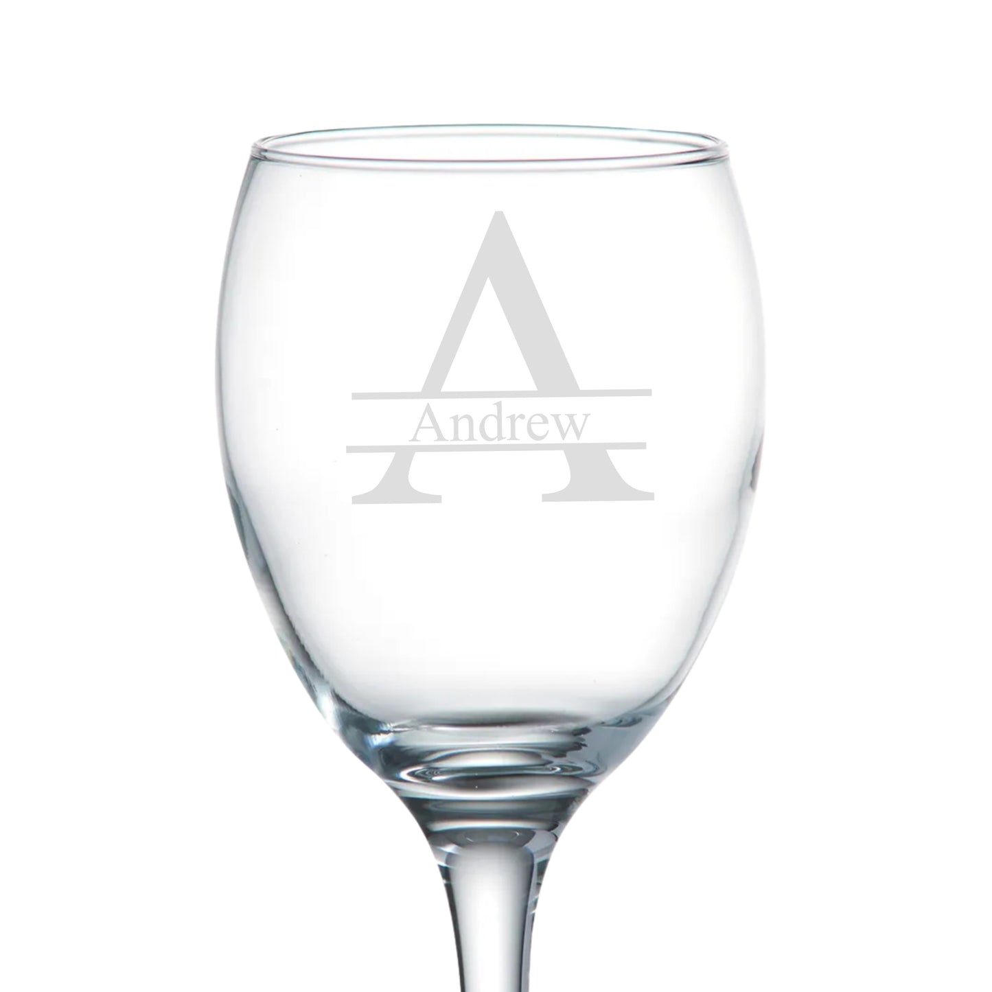 Clear wine glass with engraved 'Andrew' monogram on a white background