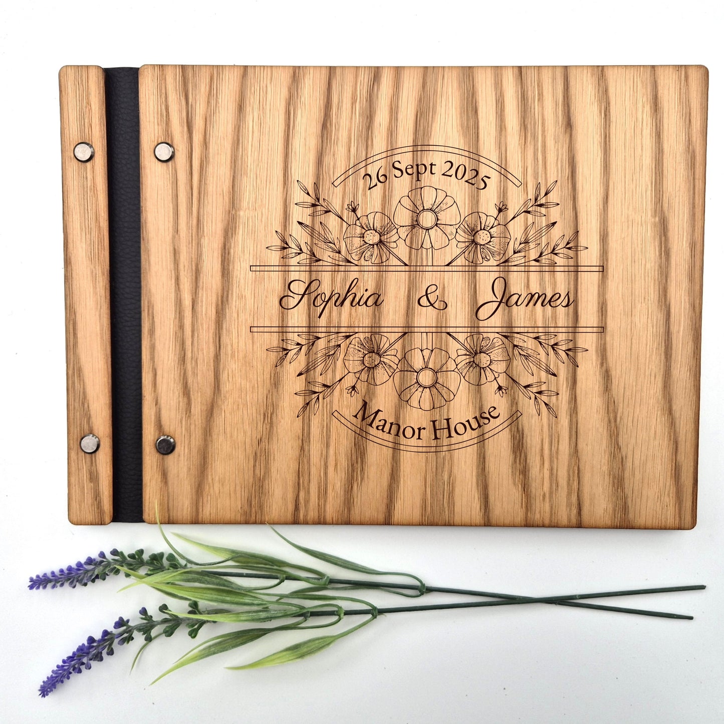 Image of a rustic style oak wedding book. The book is approximately 298mm x 216mm and includes high quality paper. The oak wedding book is laser engraved by laserengraveuk with a floral circular design to the front. The dsign includes the married couples names, date of wedding and the venue.