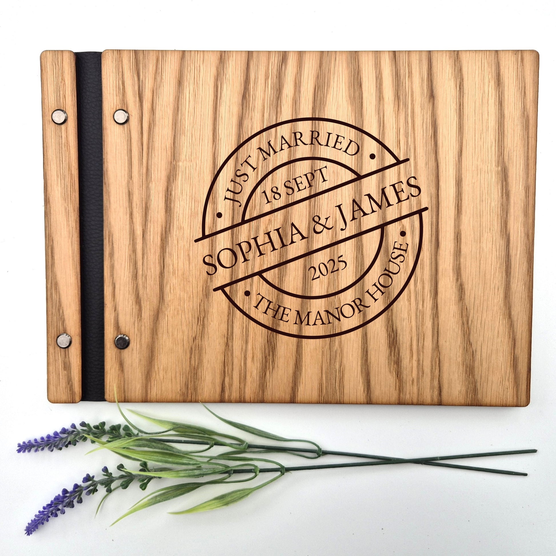 Image of a rustic style oak wedding book. The book is approximately 298mm x 216mm and includes high quality paper. The oak wedding book is laser engraved by laserengraveuk with a circular just married stamp design to the front. The design includes the married couple's names, date of wedding, and the venue.