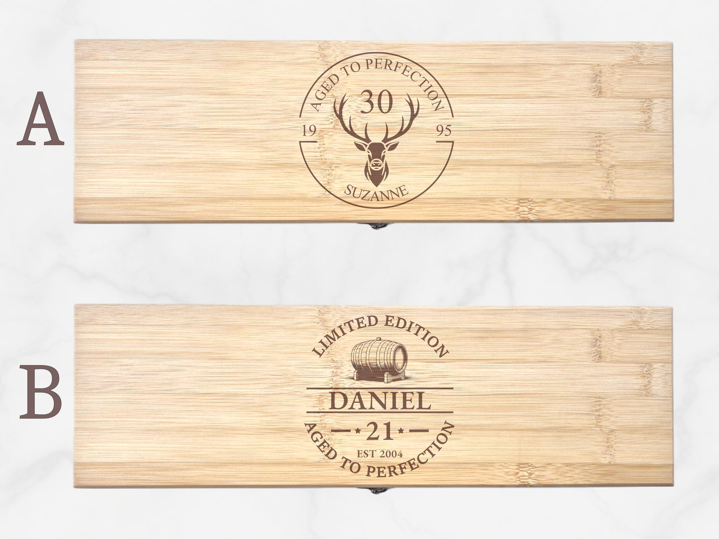 Two wooden boxes with engraved designs on a white background