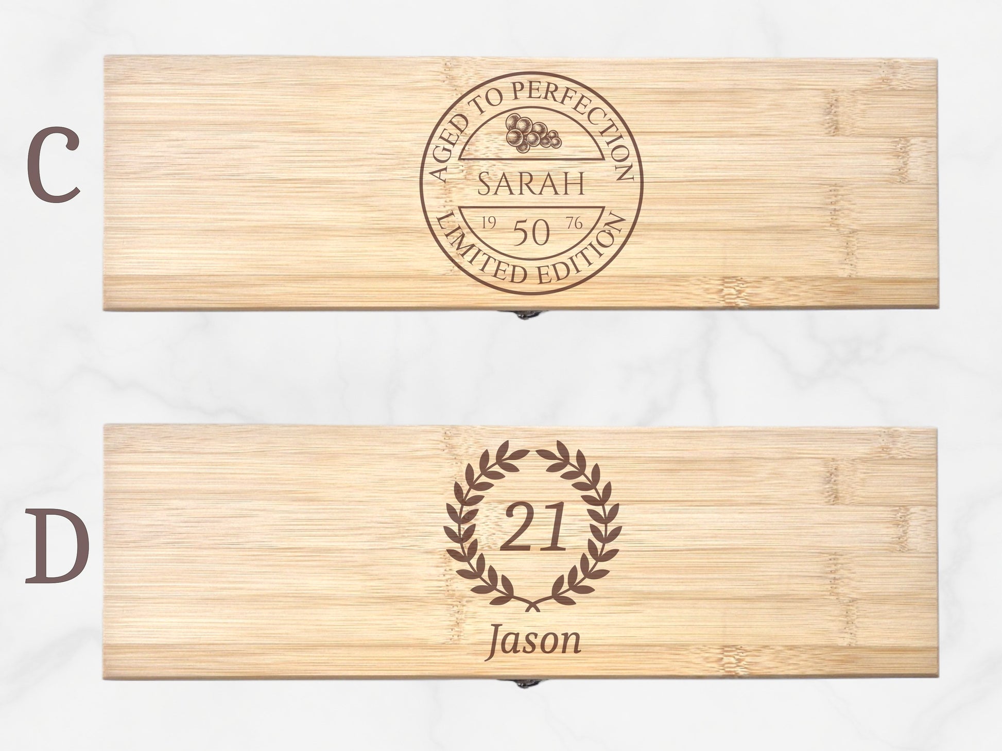 Two wooden boxes with engraved text and designs on a white background