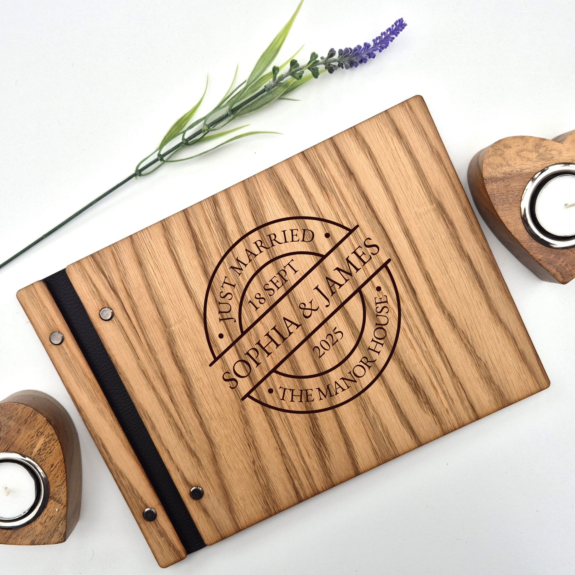 Image of a rustic style oak wedding book. The book is approximately 298mm x 216mm and includes high quality paper. The oak wedding book is laser engraved by laserengraveuk with a circular just married stamp design to the front. The design includes the married couple's names, date of wedding, and the venue.