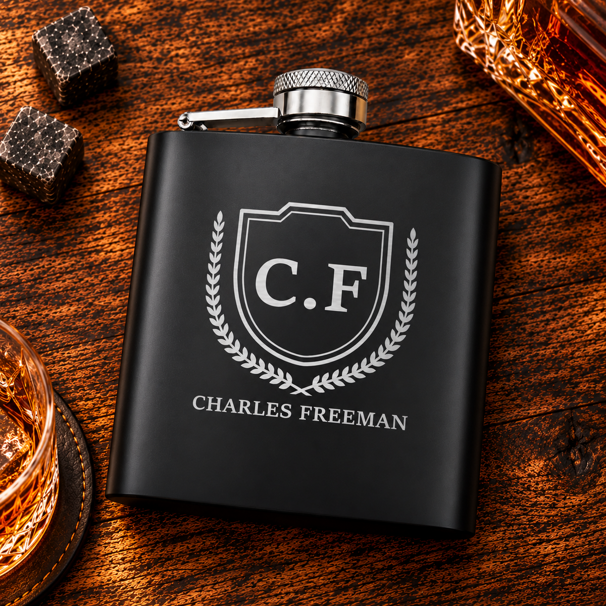 Black hip flask with CF shield monogram, laurel wreath and Charles Freeman name engraving