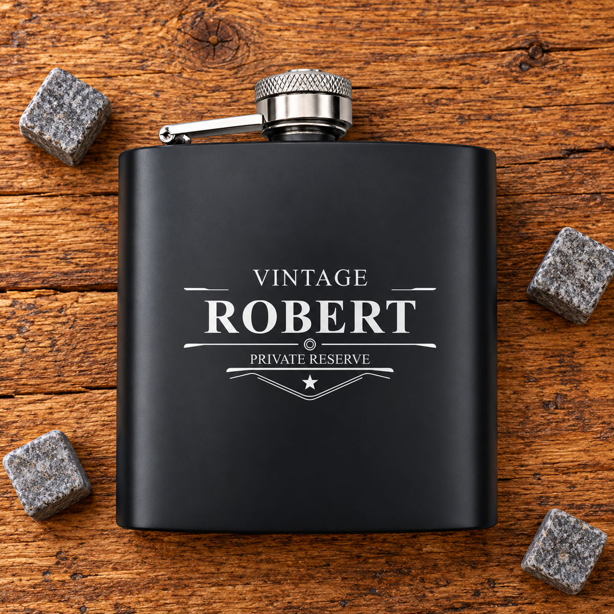 Black hip flask engraved with Robert in vintage private reserve lettering on rustic wood