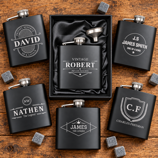 Personalised black 6oz hip flask in a satin-lined gift box with funnel, surrounded by six engraving design examples