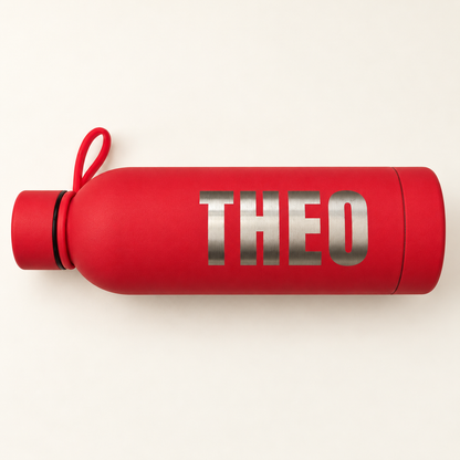 Close view of silver THEO name engraving on a red water bottle